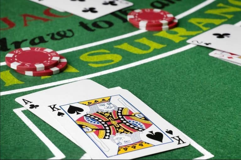 Mobile phone showing live casino lobby and game selection menu